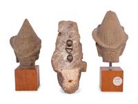 Three Carved Stone Heads of Buddha