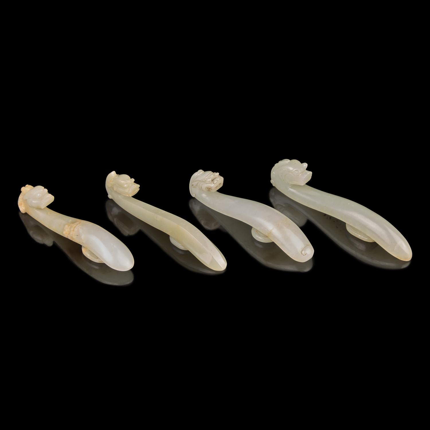 Four Pale Celadon Jade "Dragon" Belthooks, Qing Dynasty 清 青玉龍鉤四件