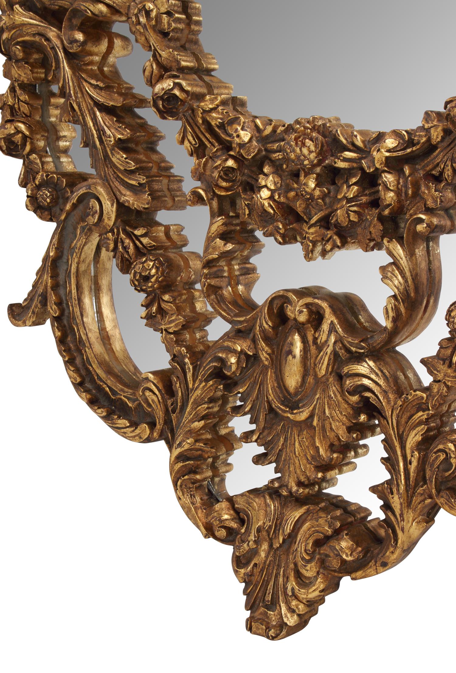 A Pair of Italian Giltwood Oval Mirrors