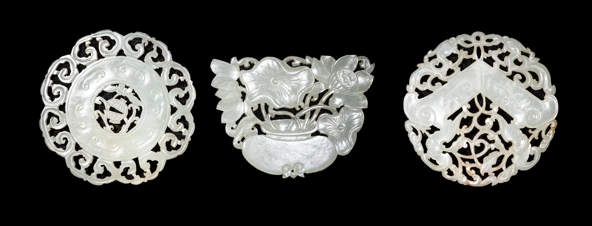 Three Chinese Reticulated White Jade Pendants