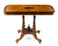 A Victorian Parcel Ebonized Burlwood Center Table Height 29 1/2 x width 42 x depth 23 inches.