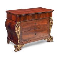 An Italian Parcel-Gilt Mahogany Chest of Drawers