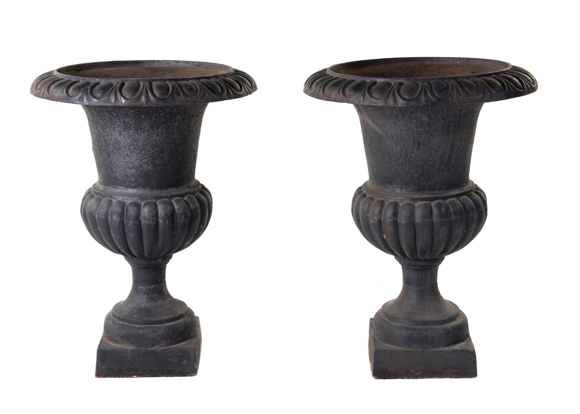 A Pair of Victorian Style Cast Iron Urns Height 31 inches. — EARLY 20TH CENTURY
