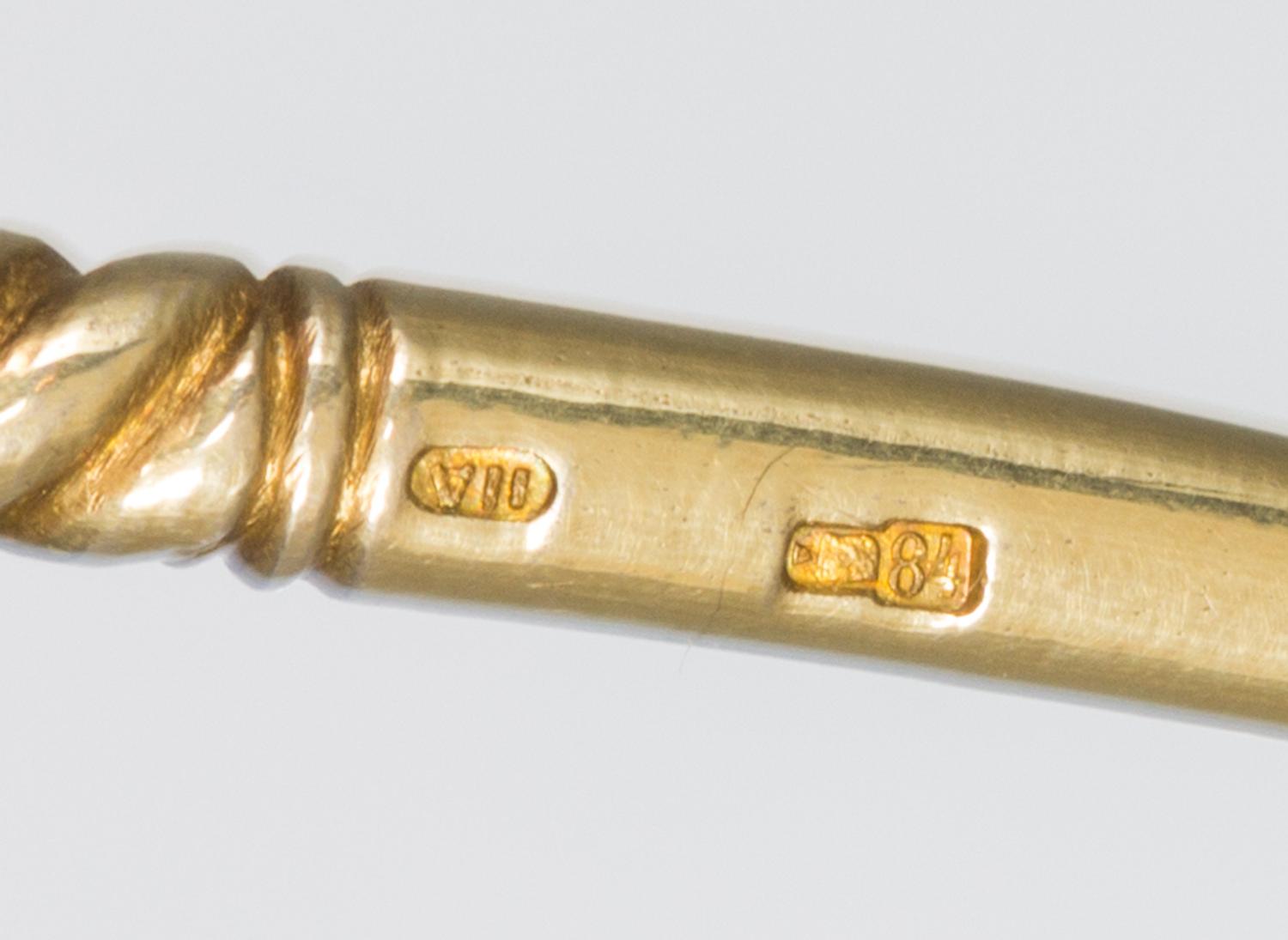 A Russian Silver-Gilt and Enamel Spoon, Mark of 11th Artel, Moscow, early 20th century, the handle decorated with polychrome foliate an