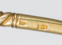 A Russian Silver-Gilt and Enamel Spoon, Mark of 11th Artel, Moscow, early 20th century, the handle decorated with polychrome foliate an