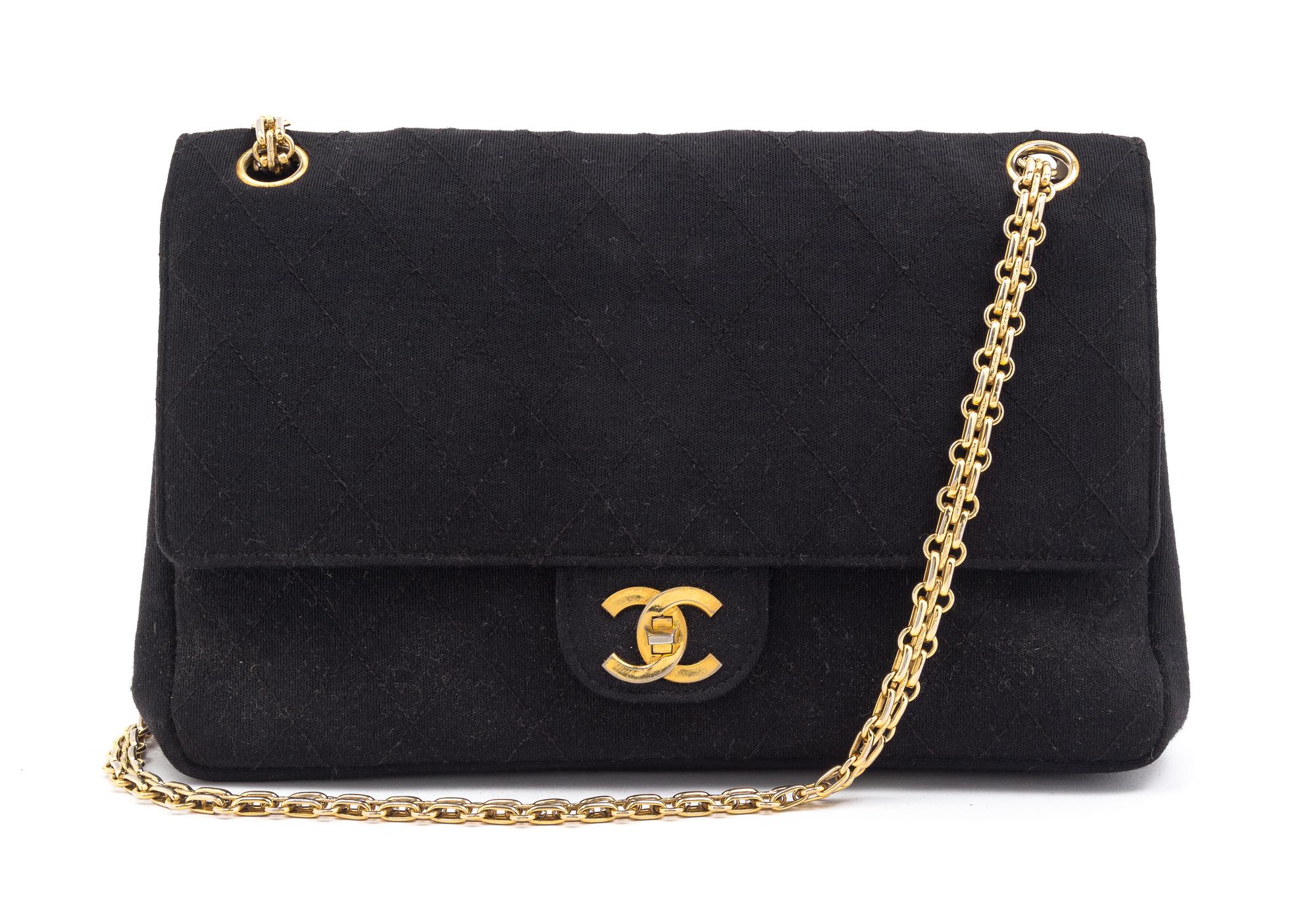A Chanel Black Fabric Mademoiselle Double Flap Bag, 11" x 7" x 3".