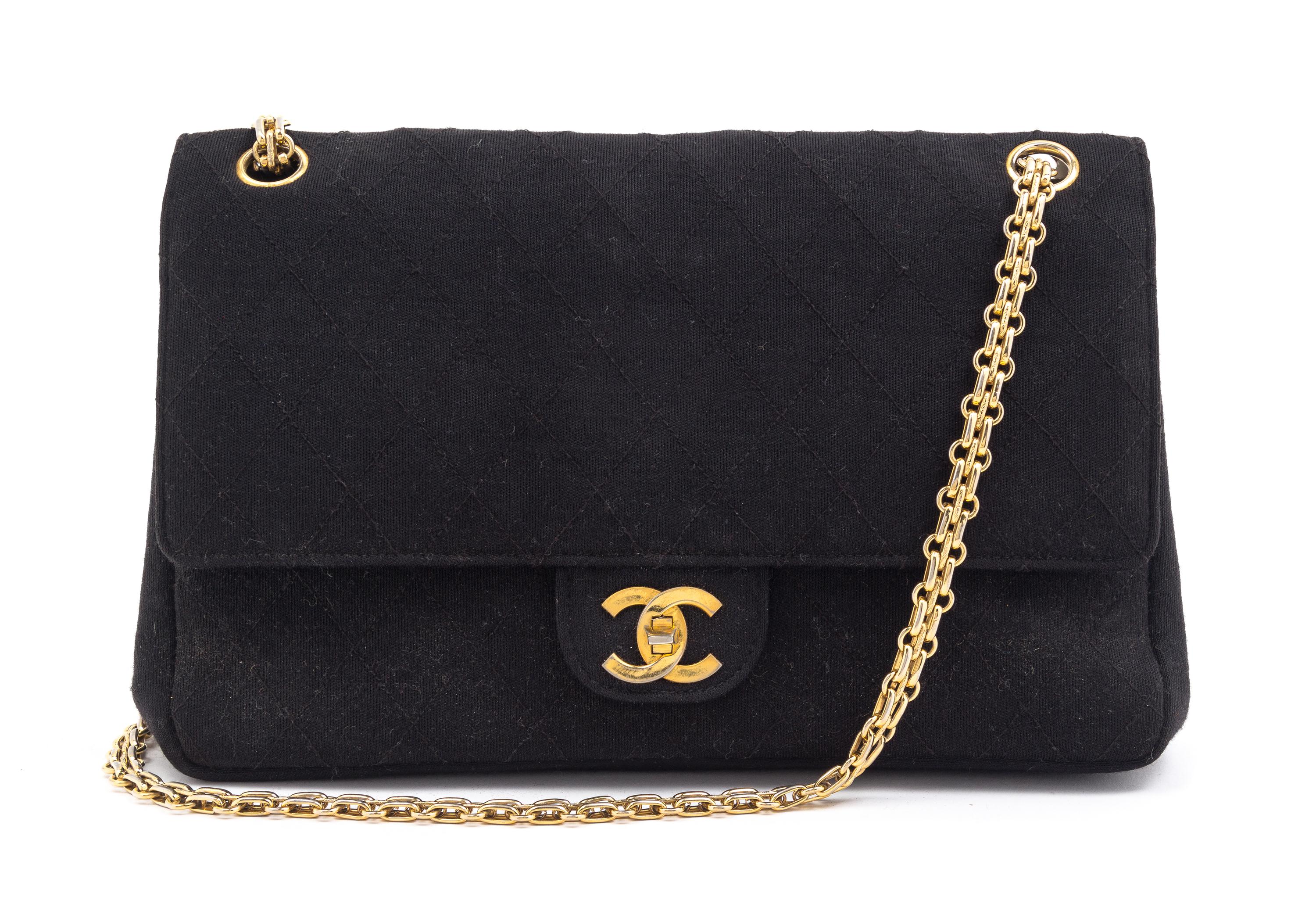 A Chanel Black Fabric Mademoiselle Double Flap Bag, 11" x 7" x 3".