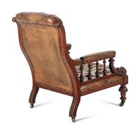 A Pair of English Carved Mahogany Buttoned Leather Armchairs