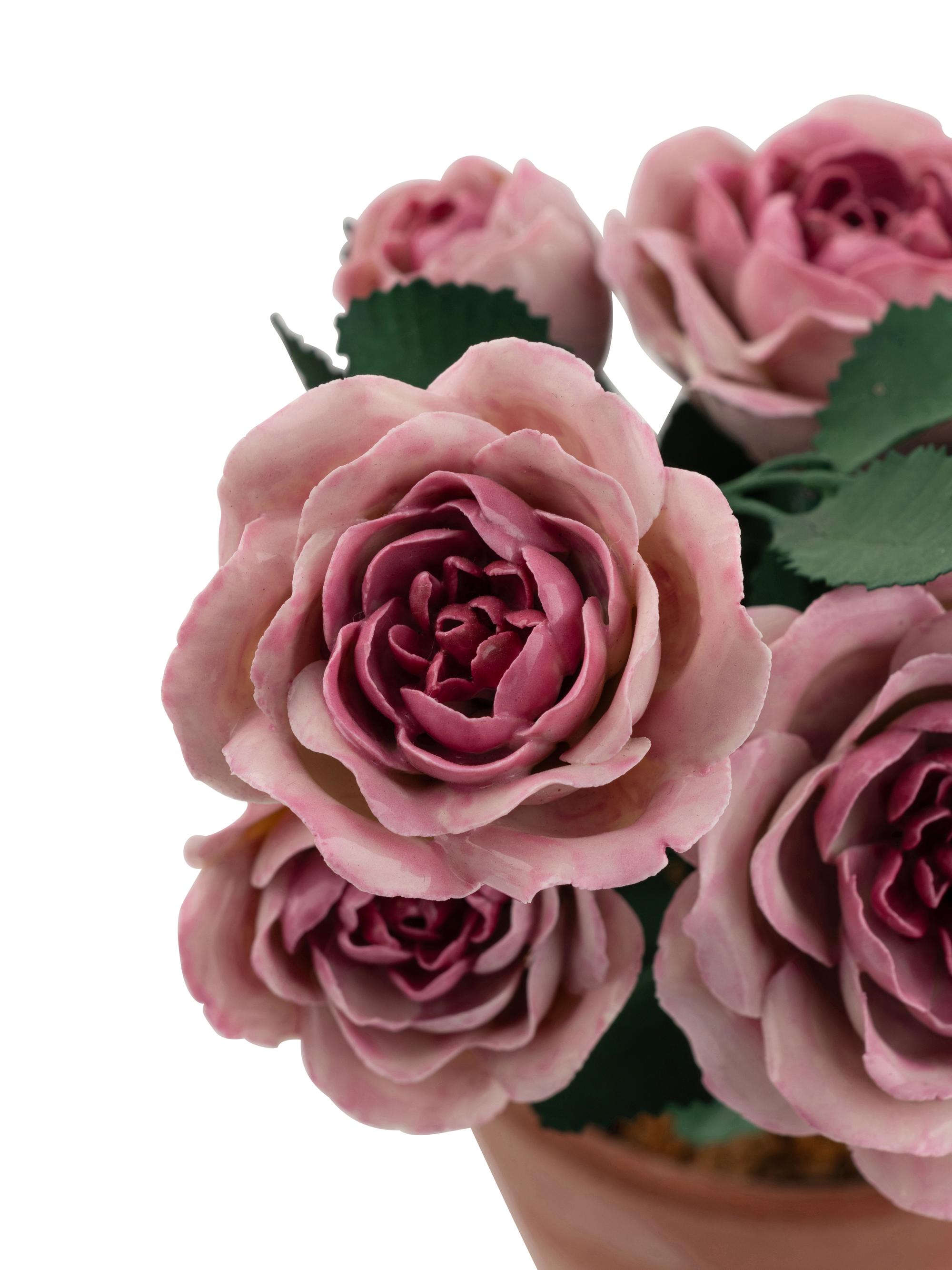 A Group of Tole and Porcelain Models of Flowers
