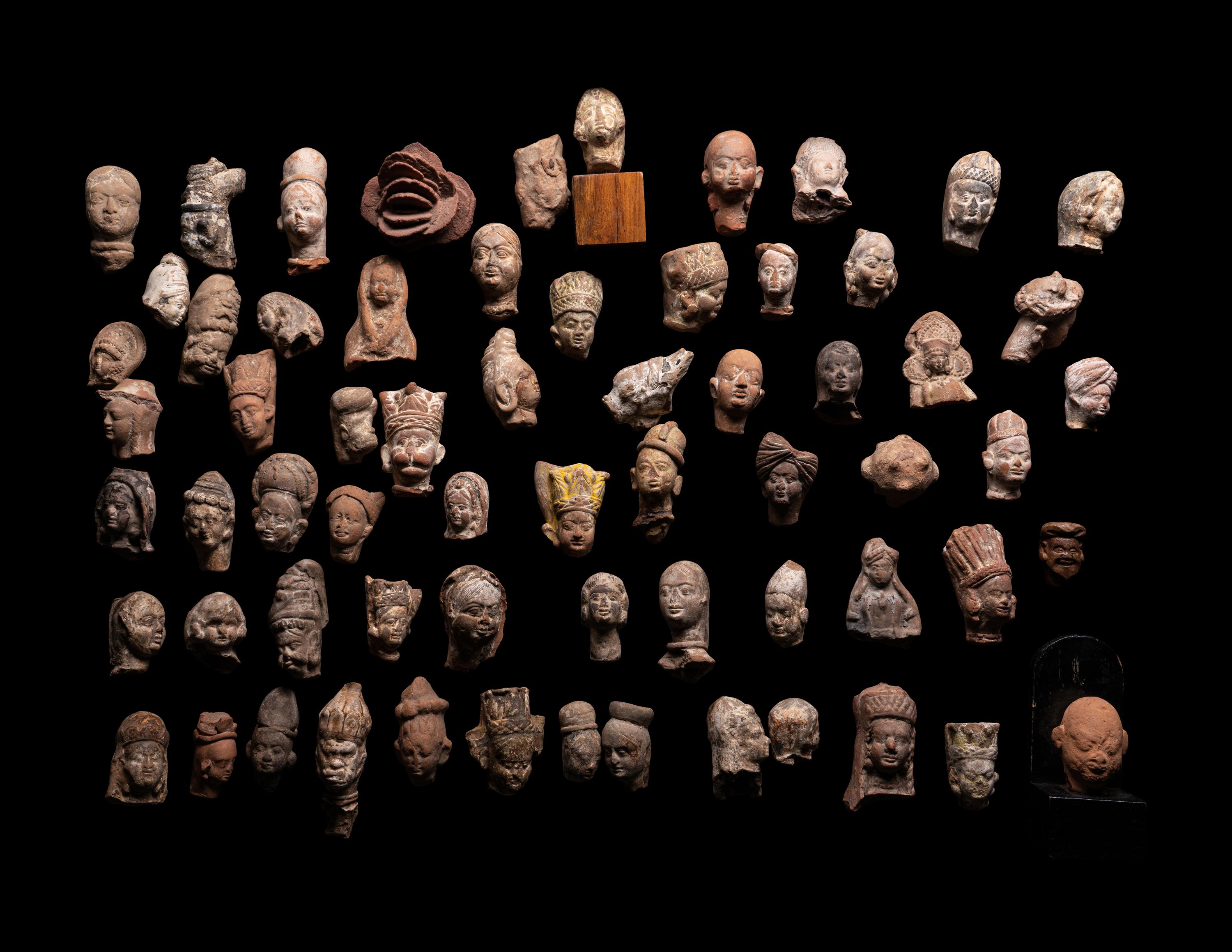 A Group of 65 Gandharan Terracotta Heads