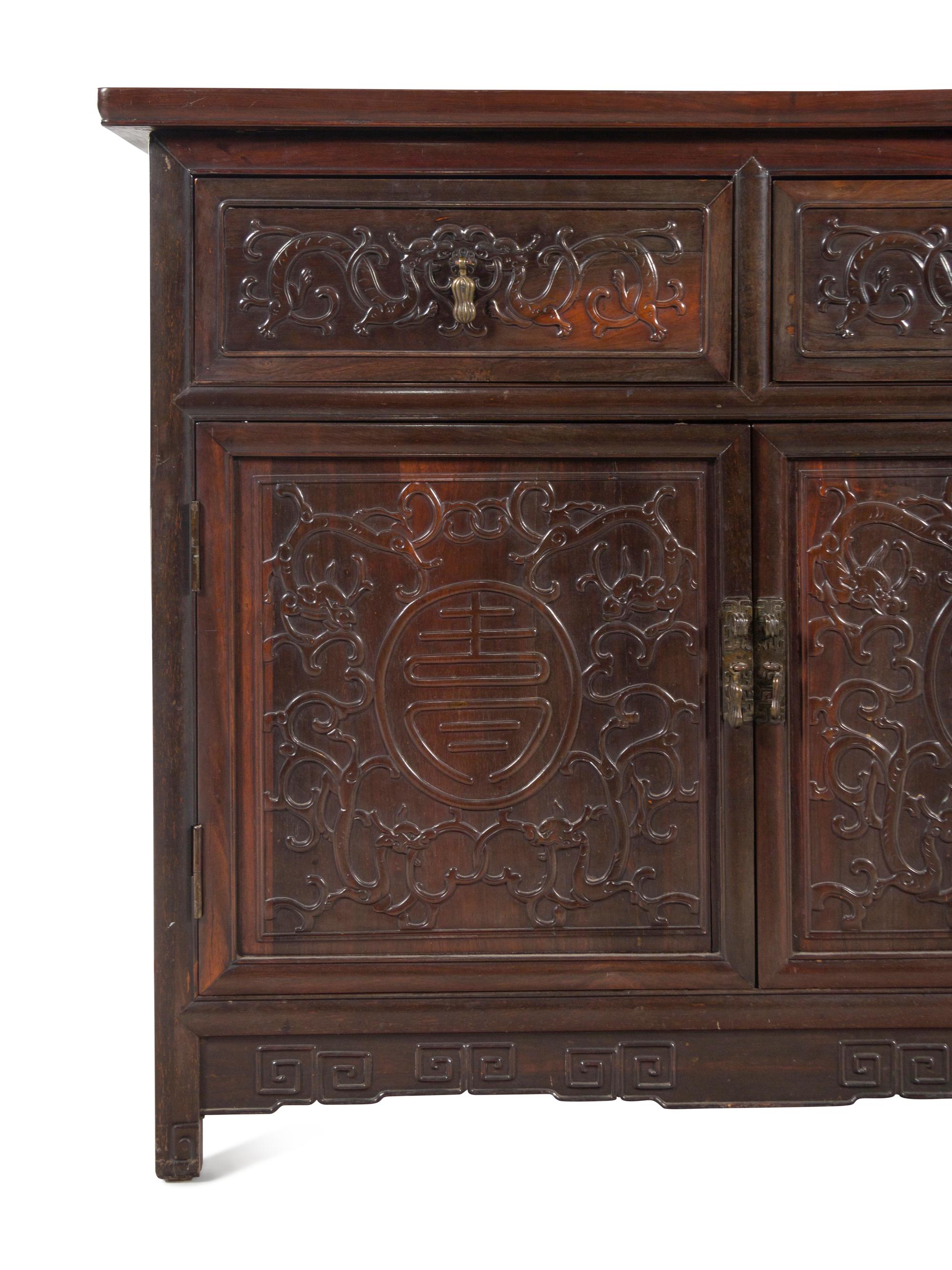 A Chinese Export Carved Hardwood Console Cabinet
