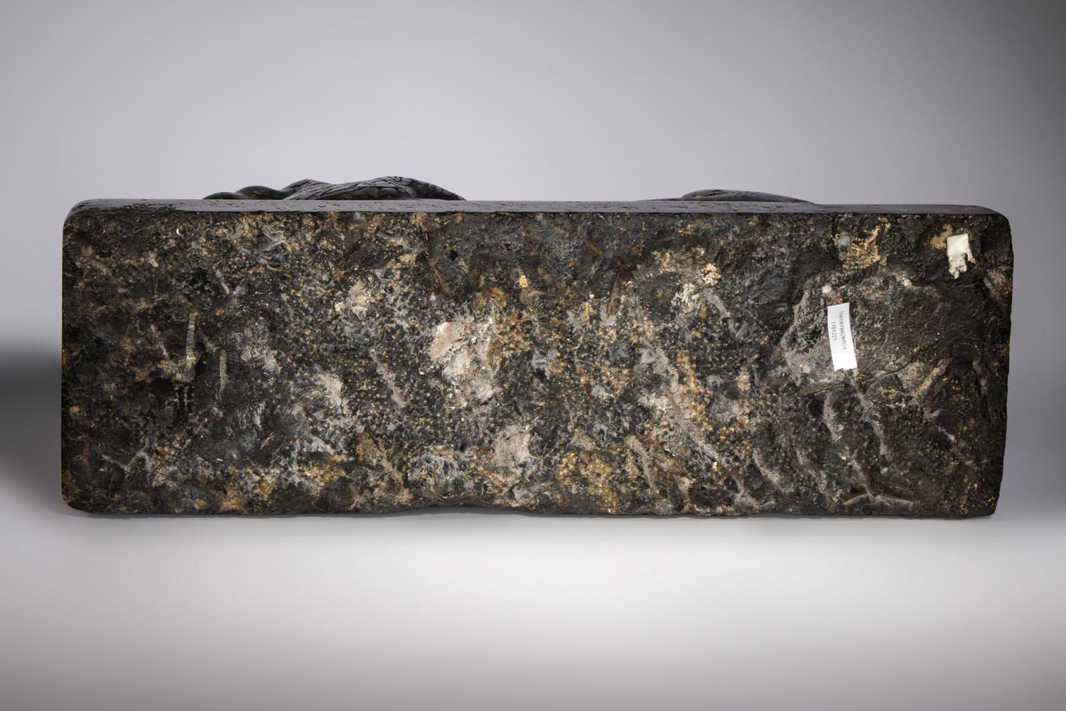 An Egyptian Black Marble Recumbent Lion