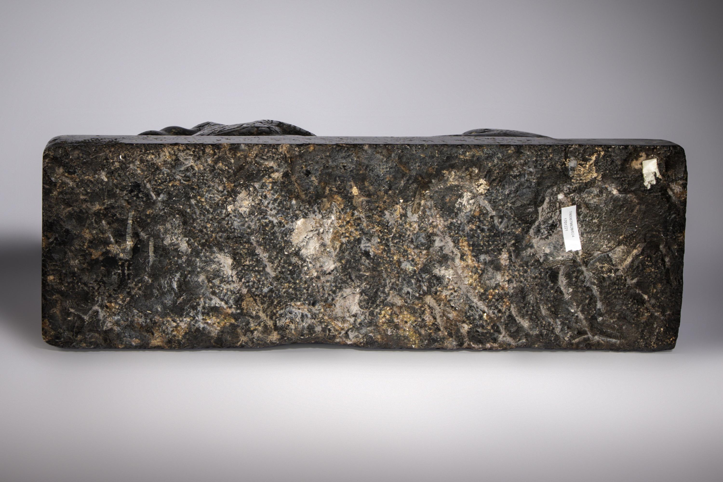An Egyptian Black Marble Recumbent Lion