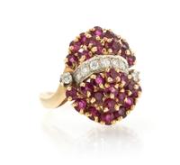 A 14 Karat Yellow Gold, Ruby and Diamond Cluster Ring, 6.70 dwts.