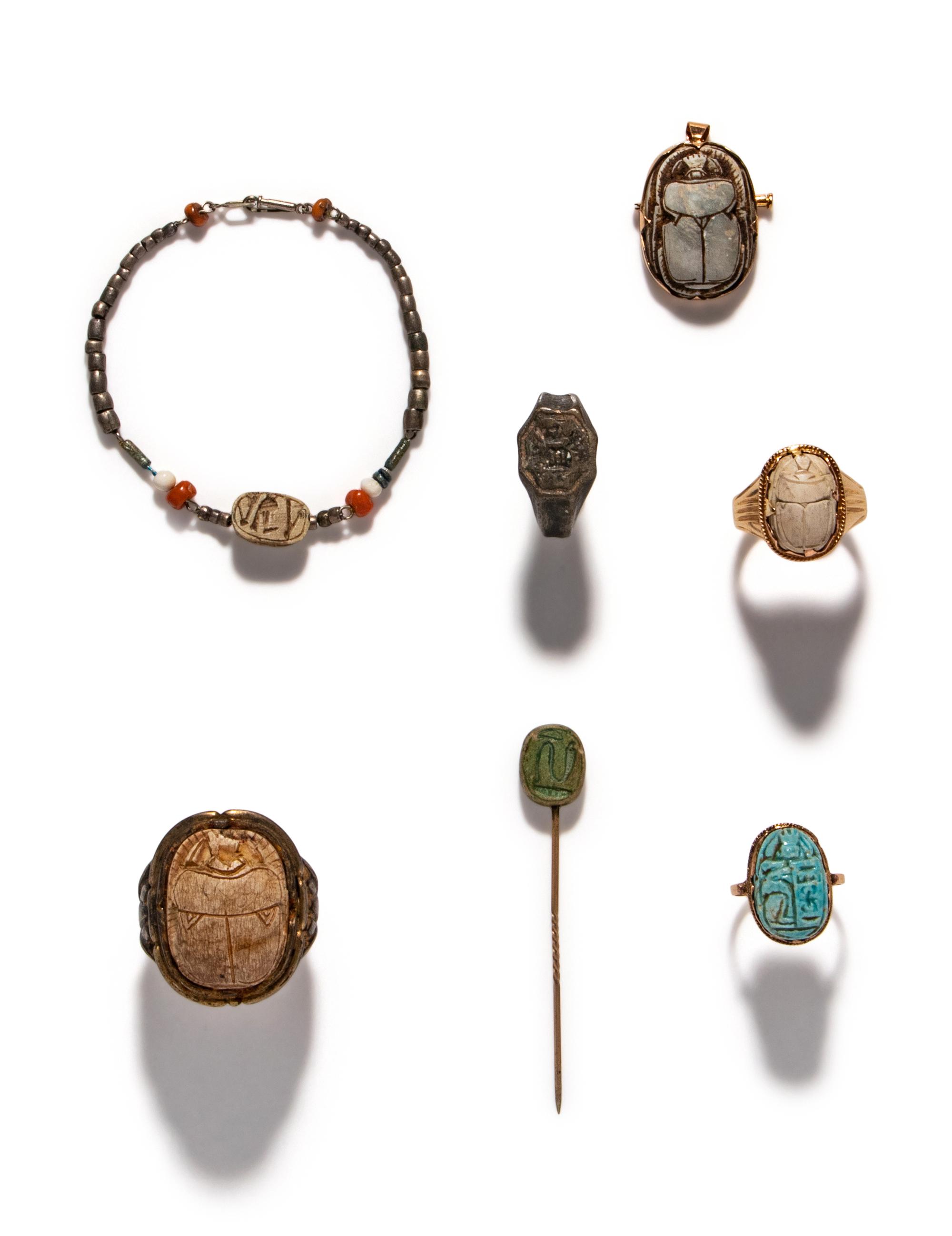 Twenty Egyptian Faience and Steatite Scarabs Mounted as Eight Revival Jewelry Items