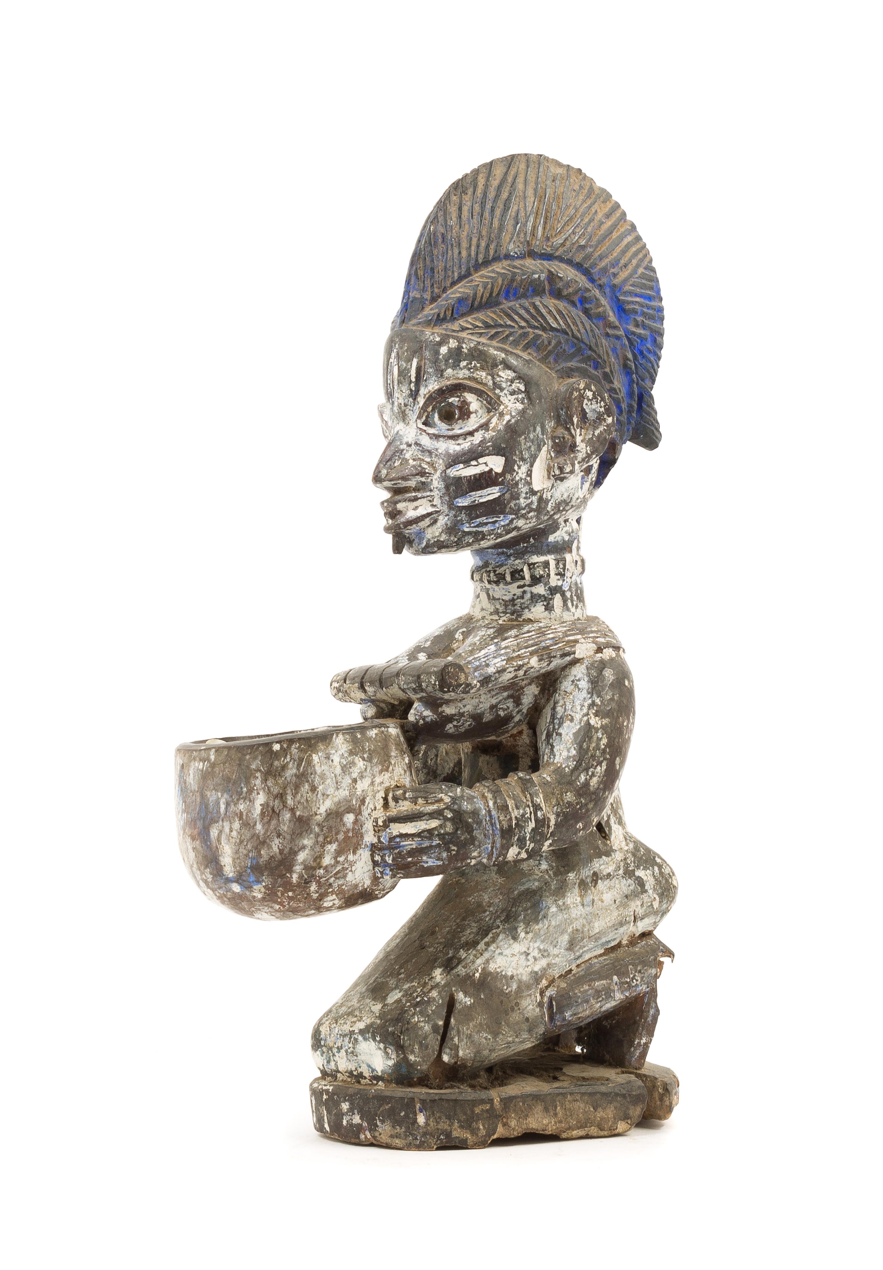 A Yoruba Wood Figure Height 14 1/2 inches. — NIGERIA, LATE 19TH/EARLY 20TH CENTURY