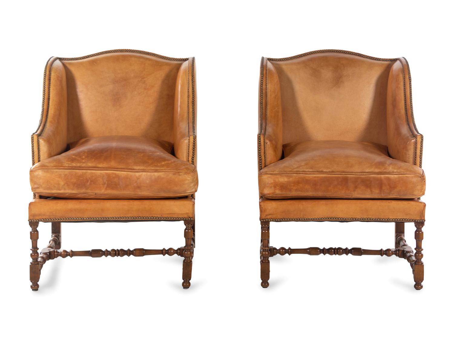 A Pair of William and Mary Style Leather-Upholstered Wingback Armchairs