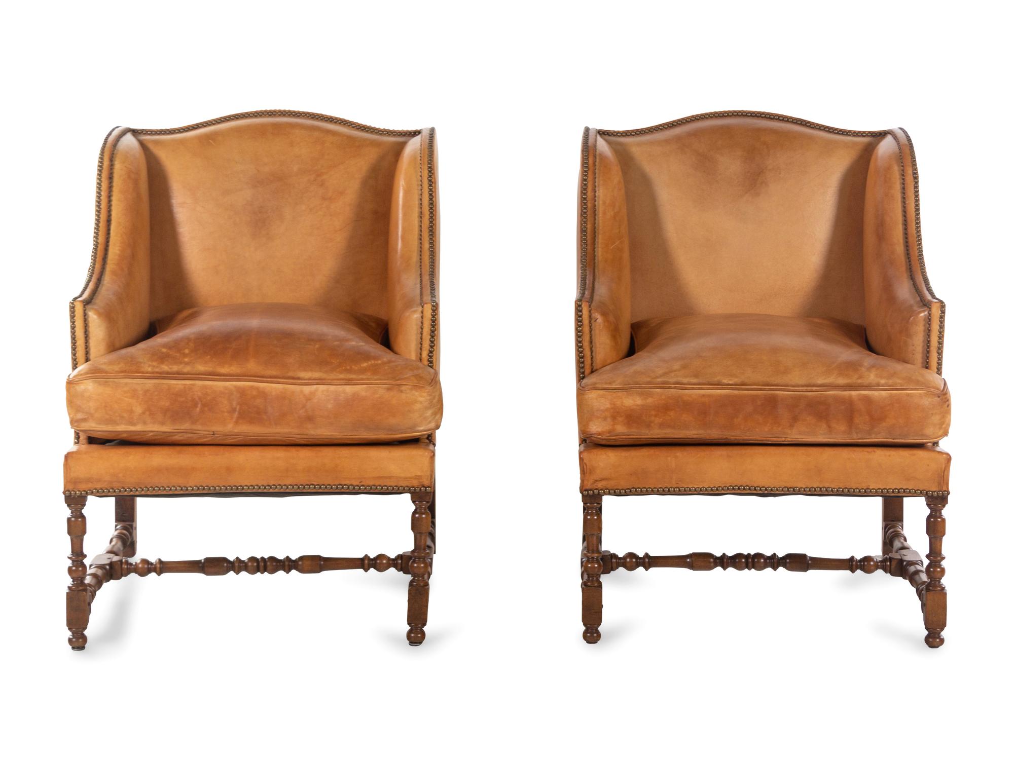 A Pair of William and Mary Style Leather-Upholstered Wingback Armchairs