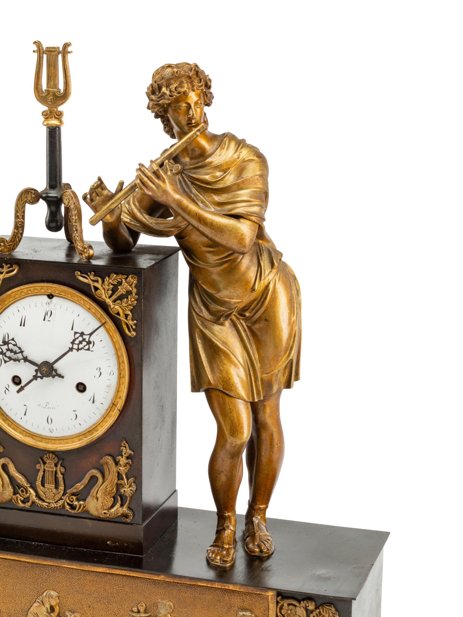A Louis Philippe Gilt and Patinated Bronze Figural Mantel Clock