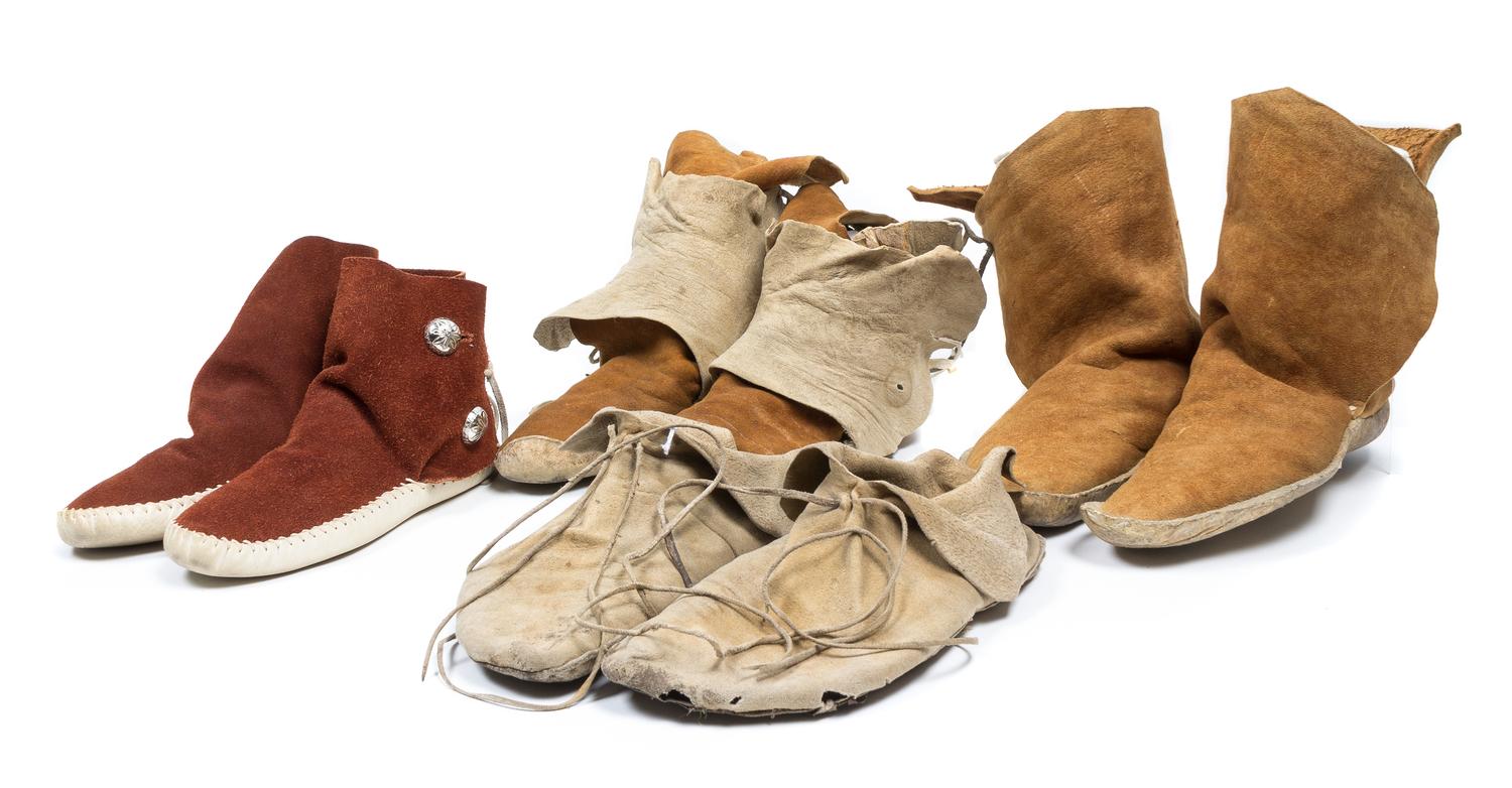 Four Pairs of Southwestern Moccasins Length of longest pair 10 1/4 inches.