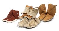 Four Pairs of Southwestern Moccasins Length of longest pair 10 1/4 inches.