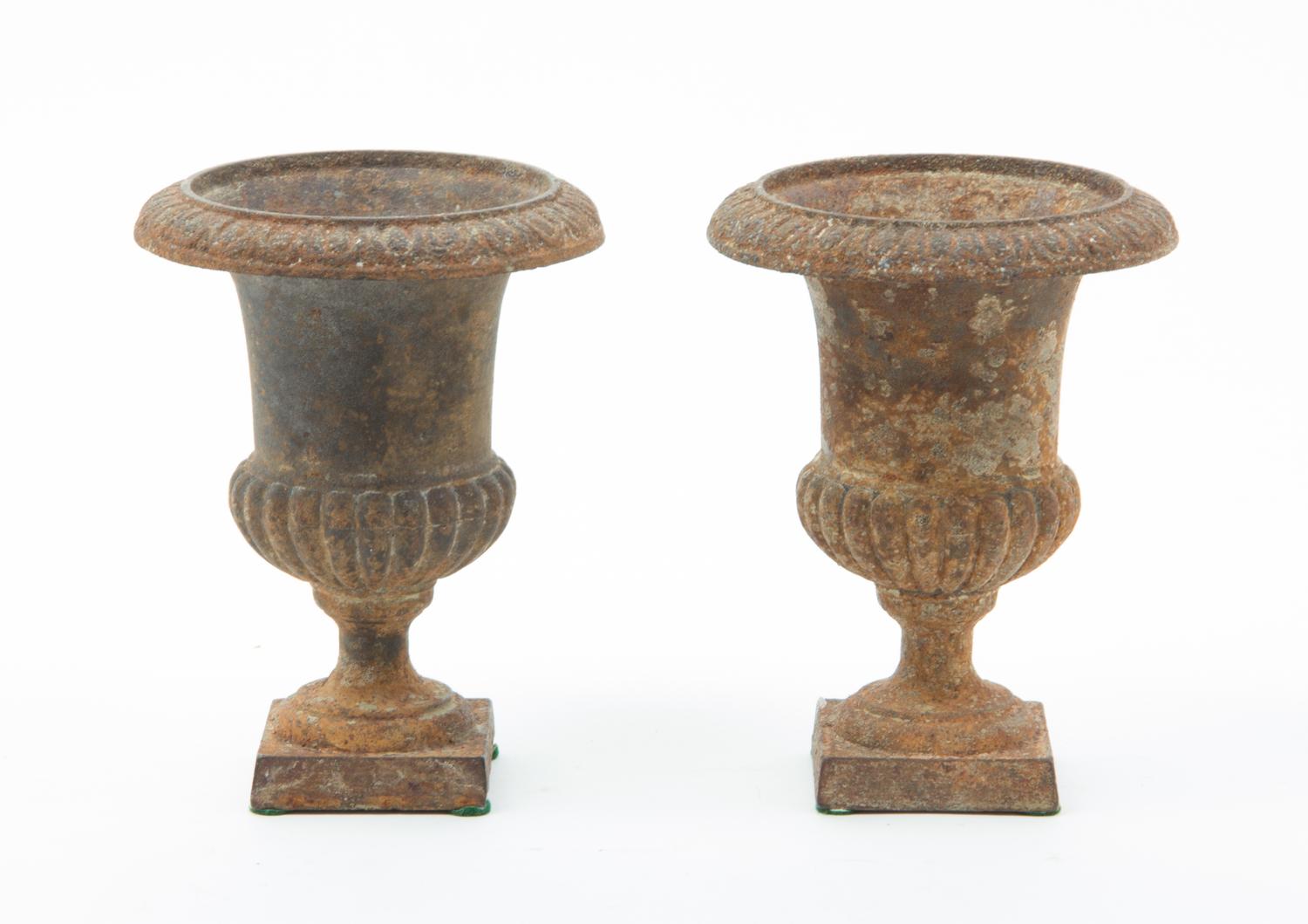 A Pair of Victorian Cast Iron Urns Height 6 1/4 inches.