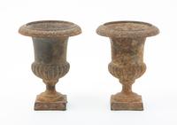 A Pair of Victorian Cast Iron Urns Height 6 1/4 inches.
