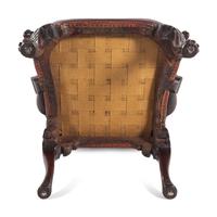 A George II Leather-Upholstered Carved Mahogany Library Chair