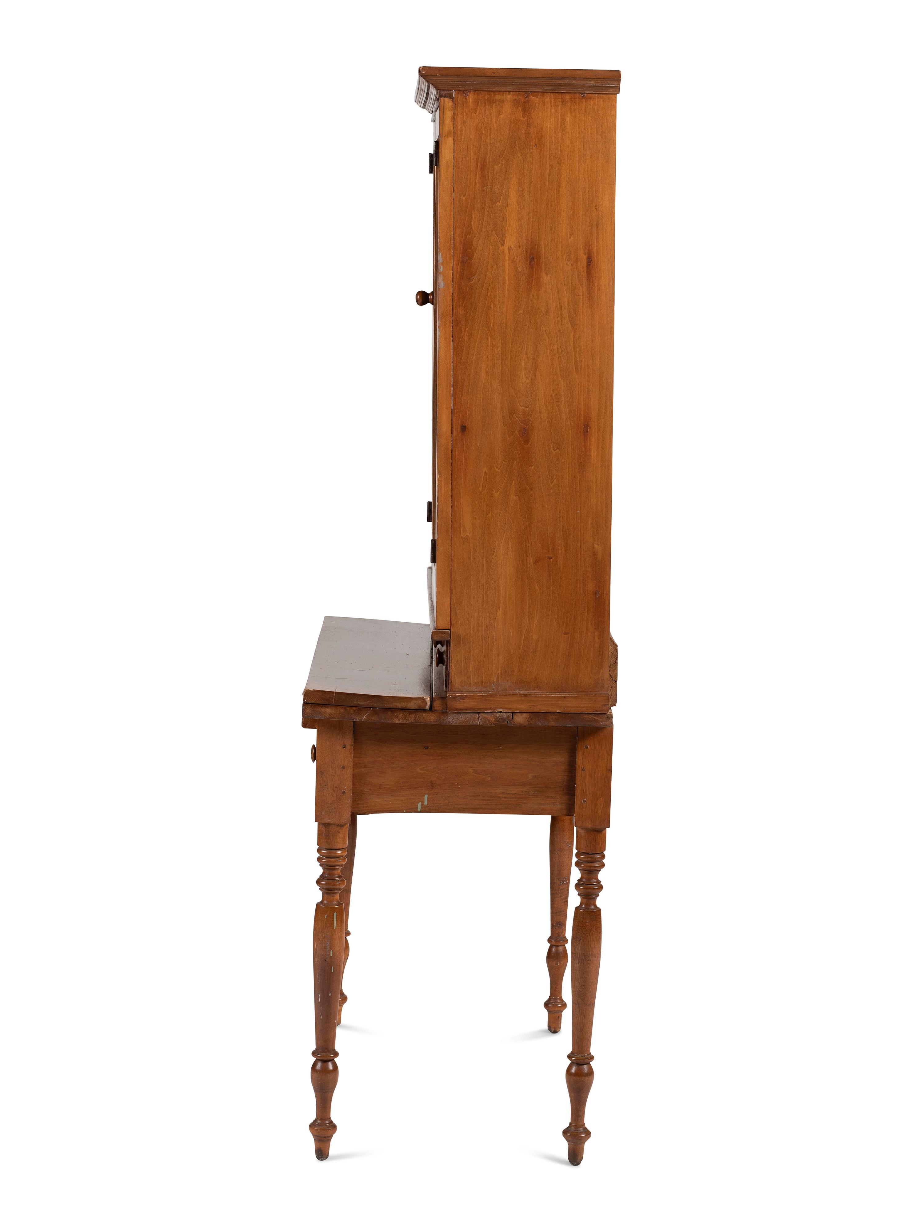 A Late Federal Cherrywood Step-Back Secretary Bookcase
