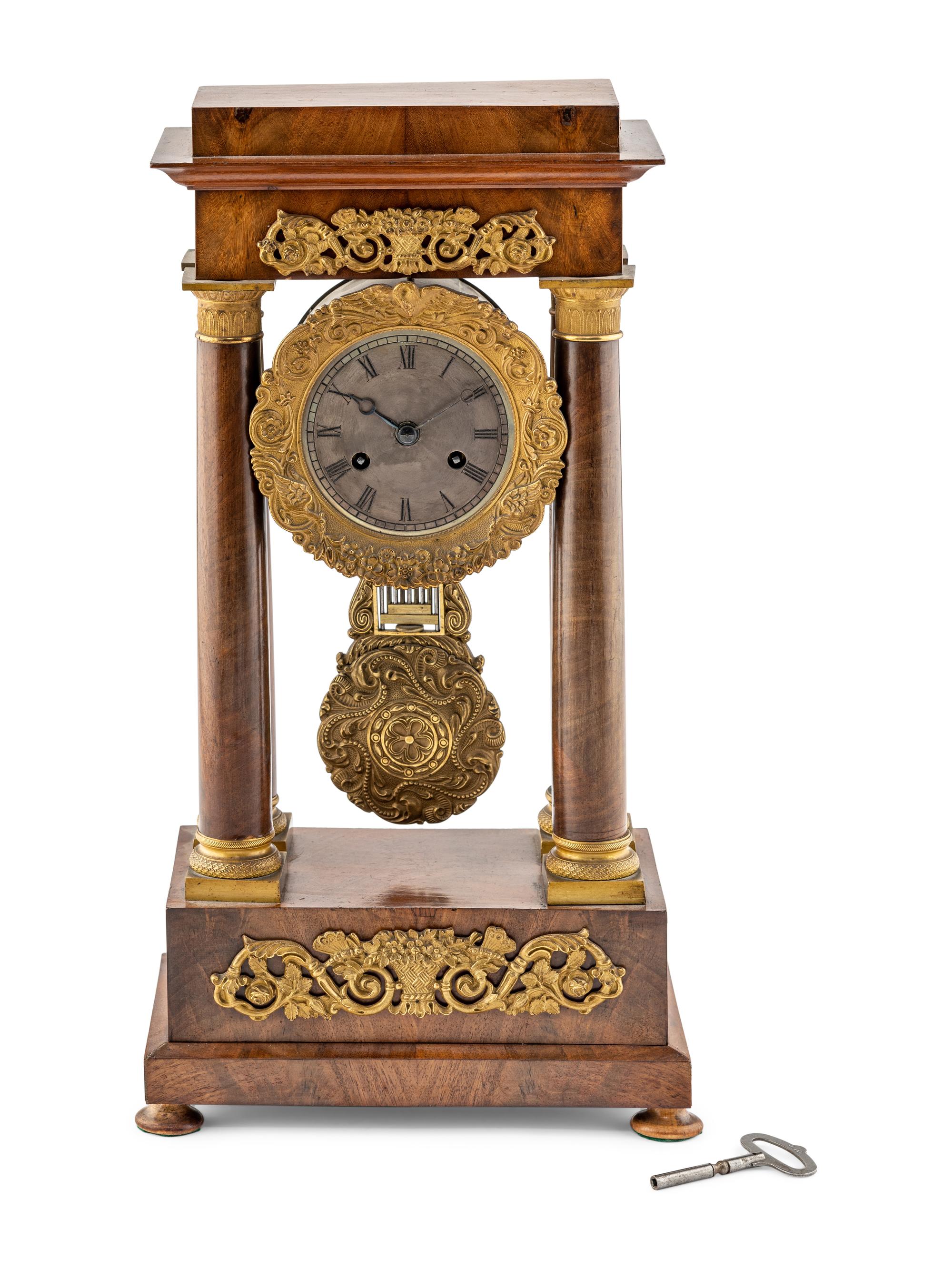 A Charles X Gilt Bronze Mounted Mahogany Mantel Clock