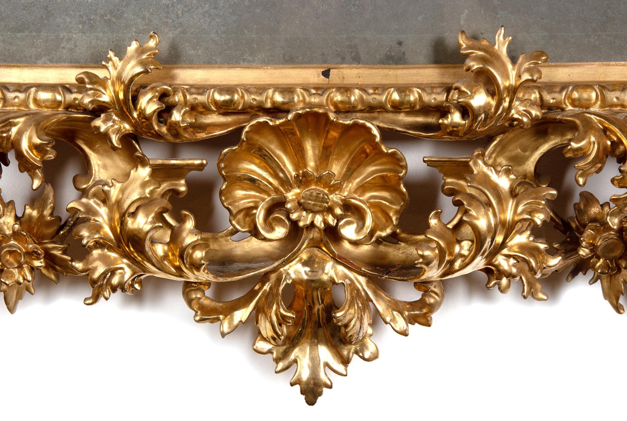 An Italian Baroque Style Carved Giltwood Mirror