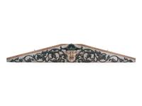 A Carved and Painted Pine Pediment Panel
