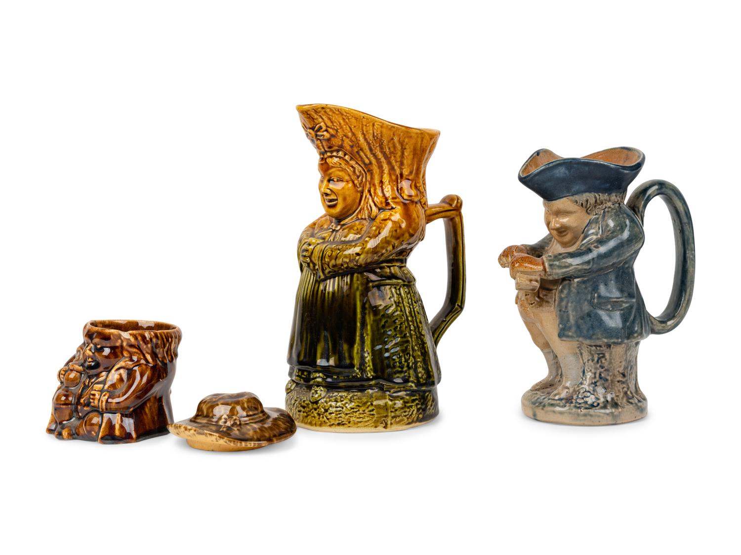 Two Toby Jugs and a Squat Toby Covered Tobacco Jar with Treacle Glaze