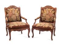 A Pair of Régence Style Walnut Fauteuils