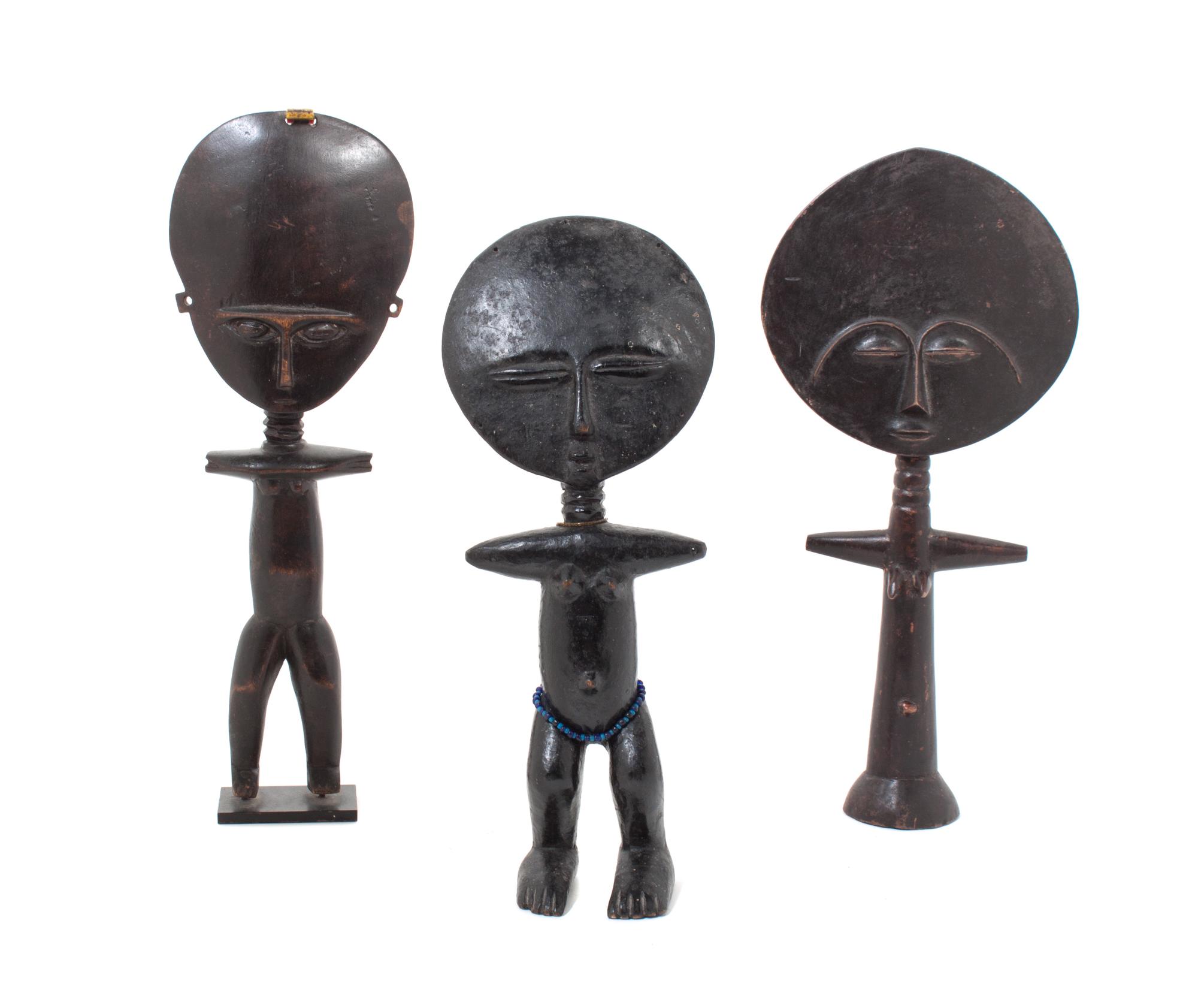 Three Carved Wood African Figures Height of tallest 15 1/2 inches.