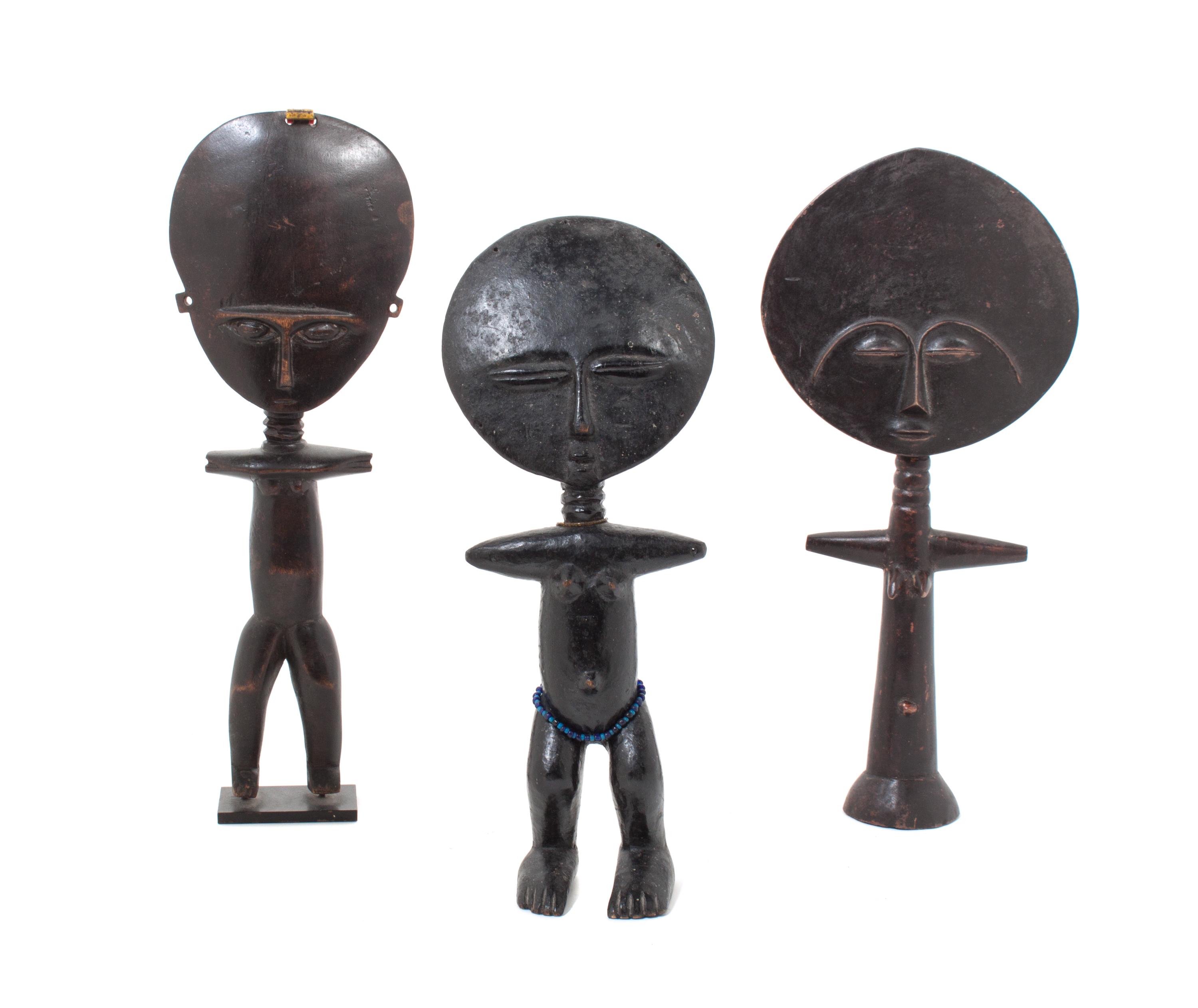 Three Carved Wood African Figures Height of tallest 15 1/2 inches.