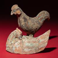 A Chinese Painted Pottery Mandarin Duck and a Cockerel, Han Dynasty — 漢 灰陶彩繪鴛鴦與小公雞