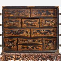 A George III Gilt Decorated Black Lacquered Cabinet on Stand late 18th century