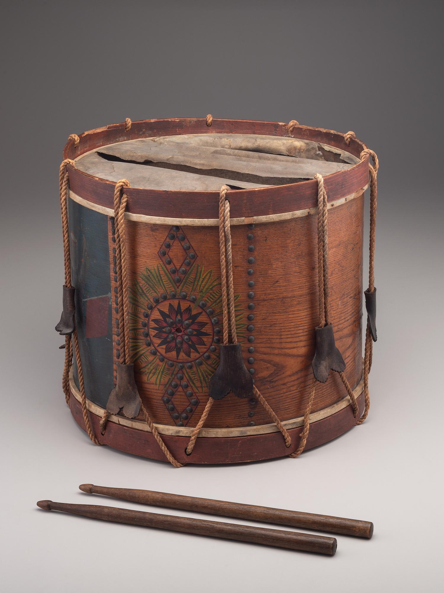 [MILITARIA]. Possibly Mexican War painted drum featuring ornate tack design, with drumsticks.