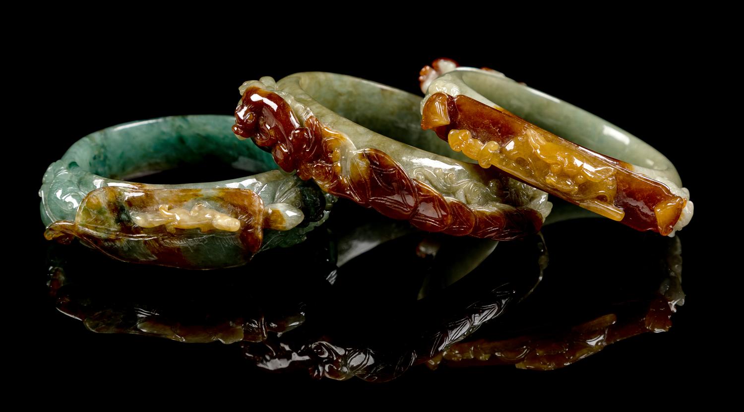 Three Chinese Russet and Green Jadeite Bangles