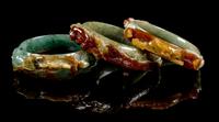 Three Chinese Russet and Green Jadeite Bangles