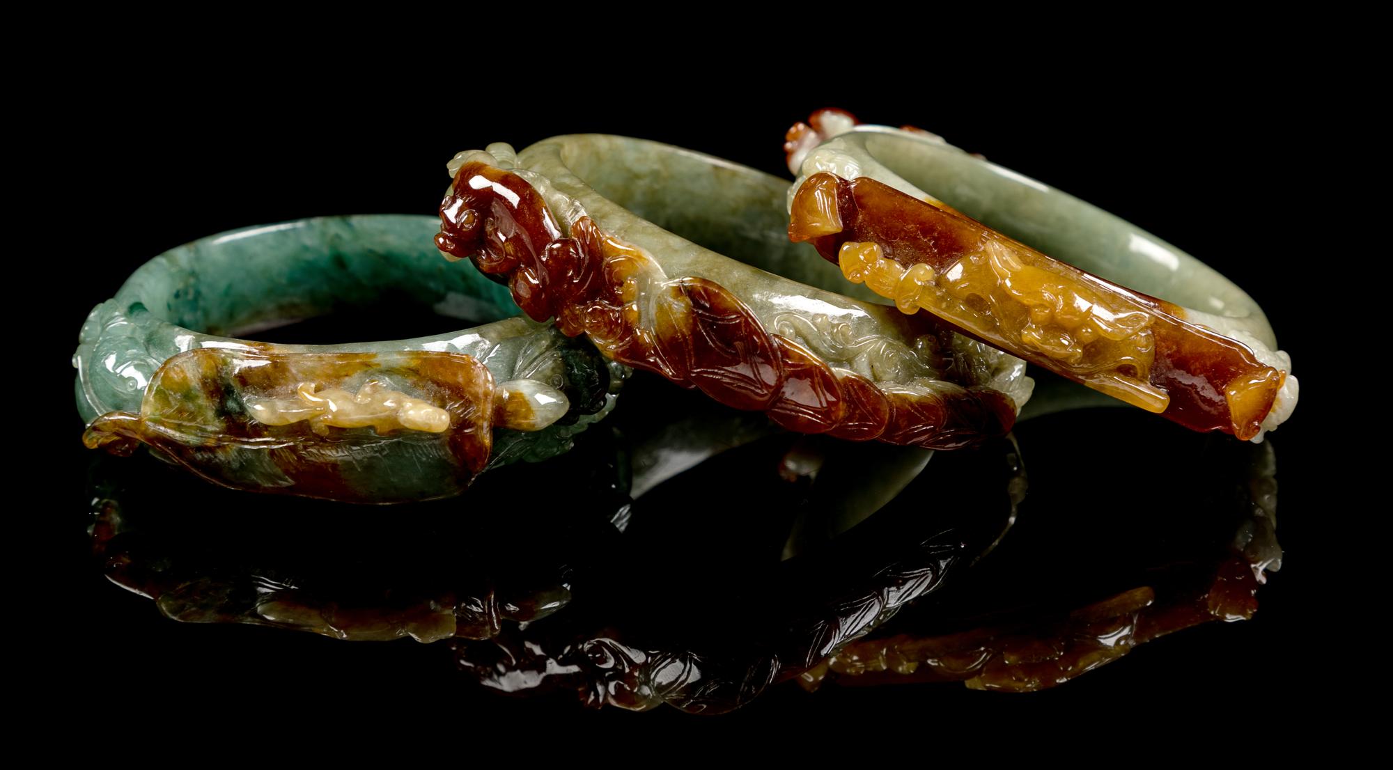 Three Chinese Russet and Green Jadeite Bangles