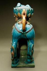 A Turquoise, Ochre and Green Glazed Tileworks 'Fu Lion' Stand