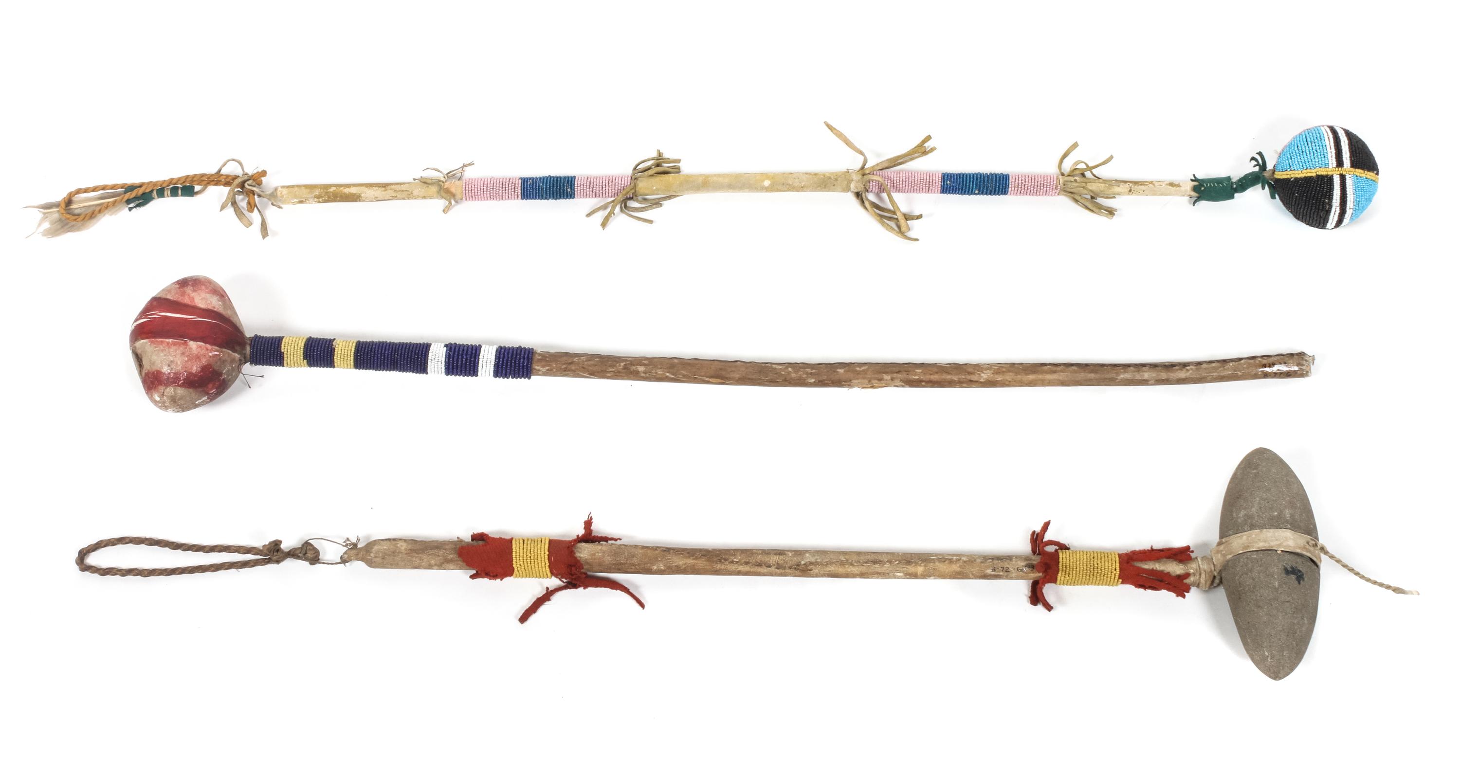 Three Beaded, Stone and Wood Clubs Length of larger 28 inches.