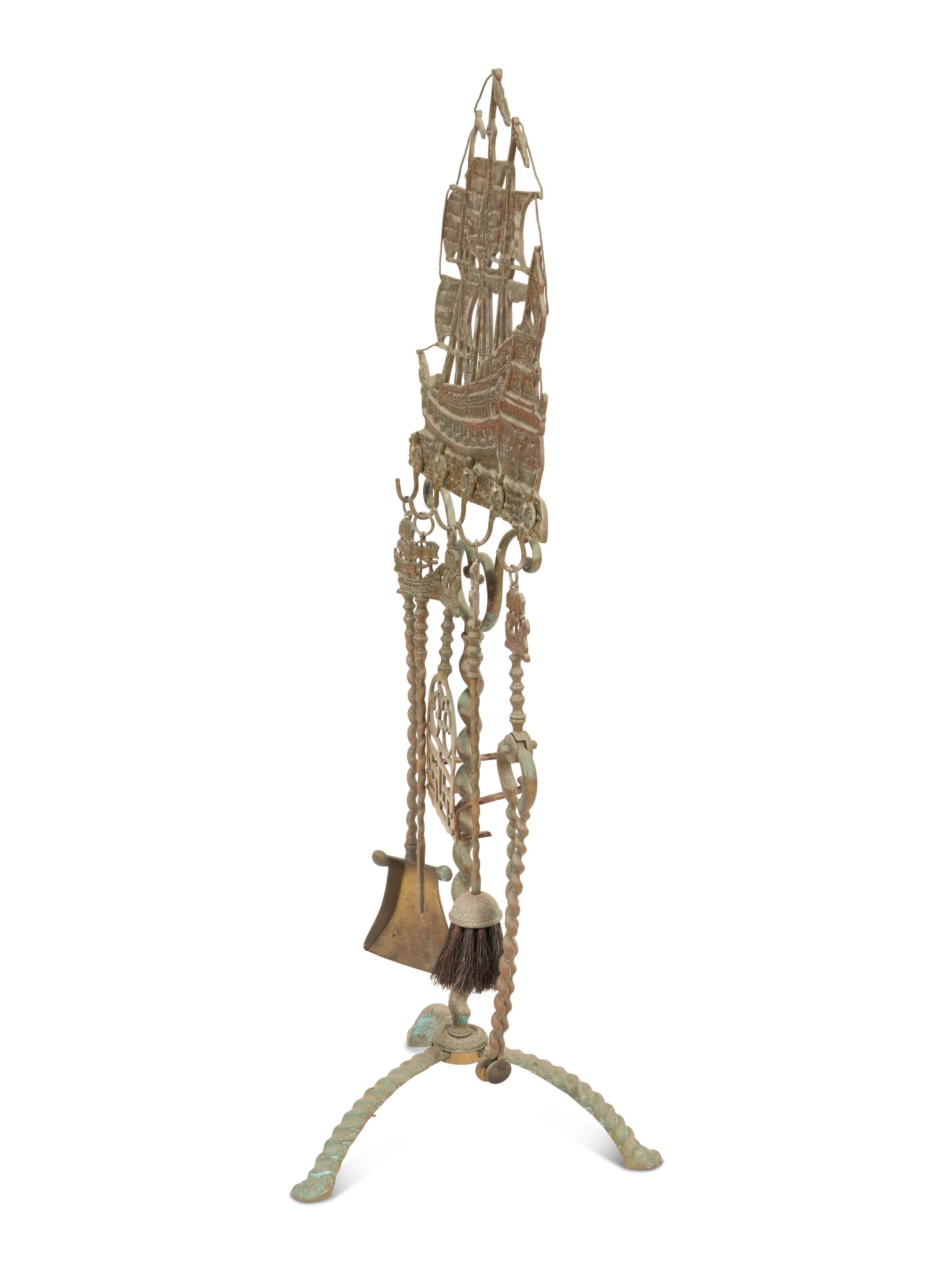 A Mizner Wrought Iron Fireplace Stand with Five Implements