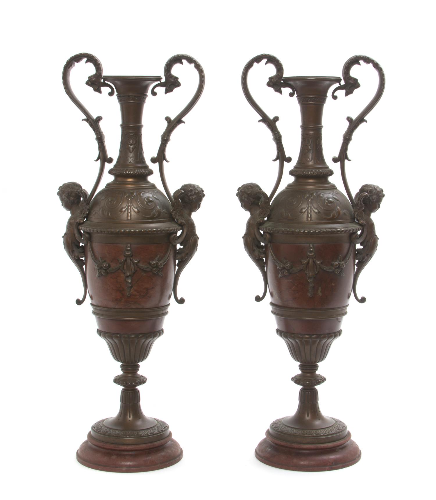 A Pair of Neoclassical Bronzed Urns, Height 15 inches.