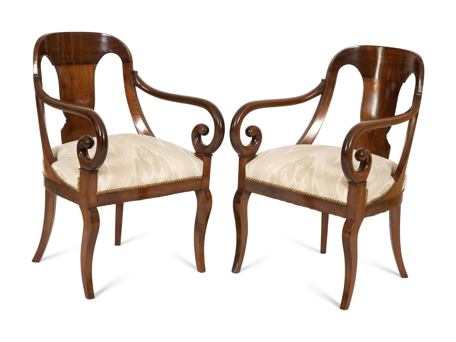 A Pair of Empire Style Mahogany Arm Chairs
