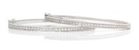 A Pair of 18 Karat White Gold and Diamond Bangle Bracelets, 16.90 dwts.