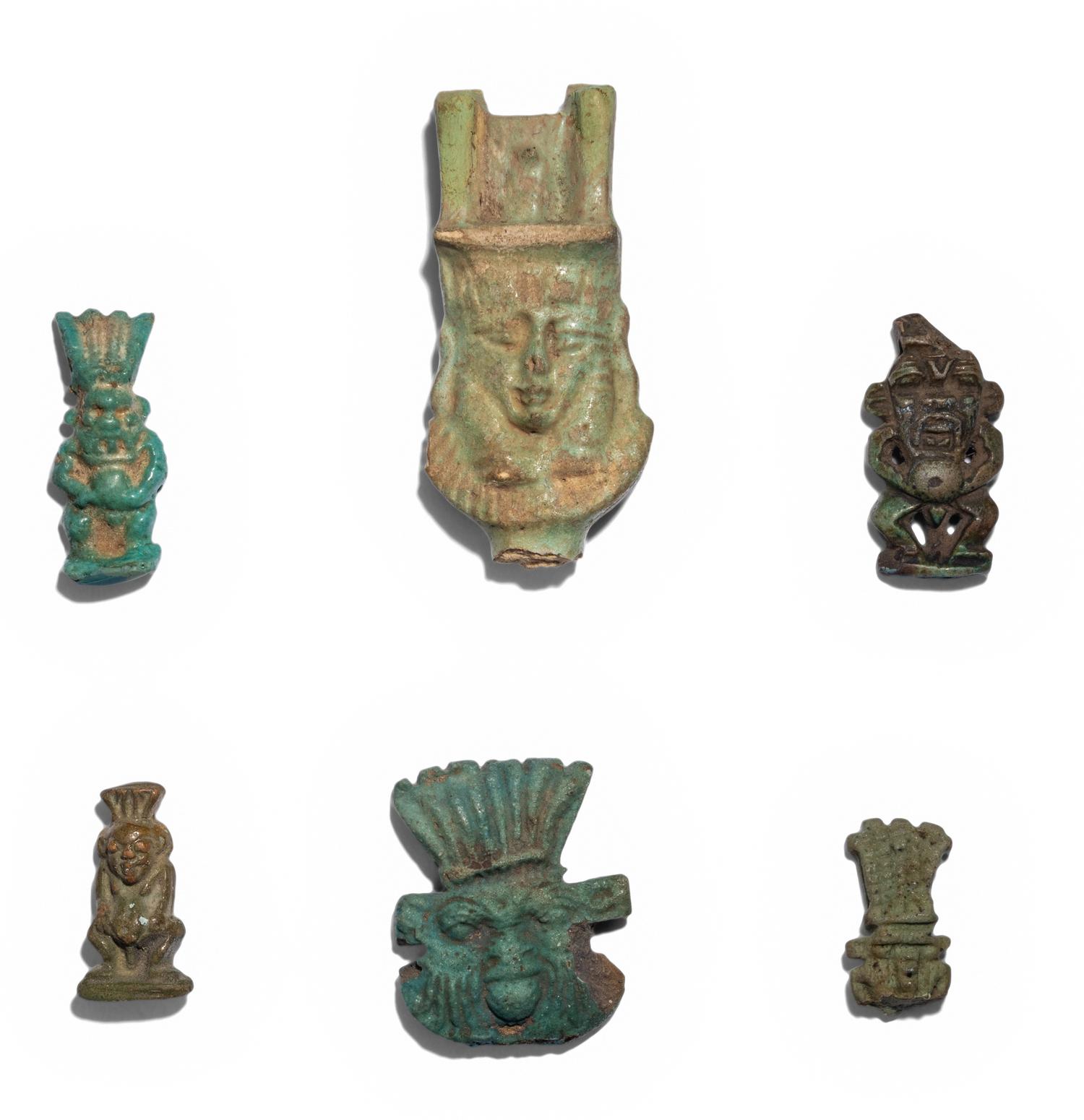 Eleven Egyptian Faience and Terracotta Bes Figures and Amulets
