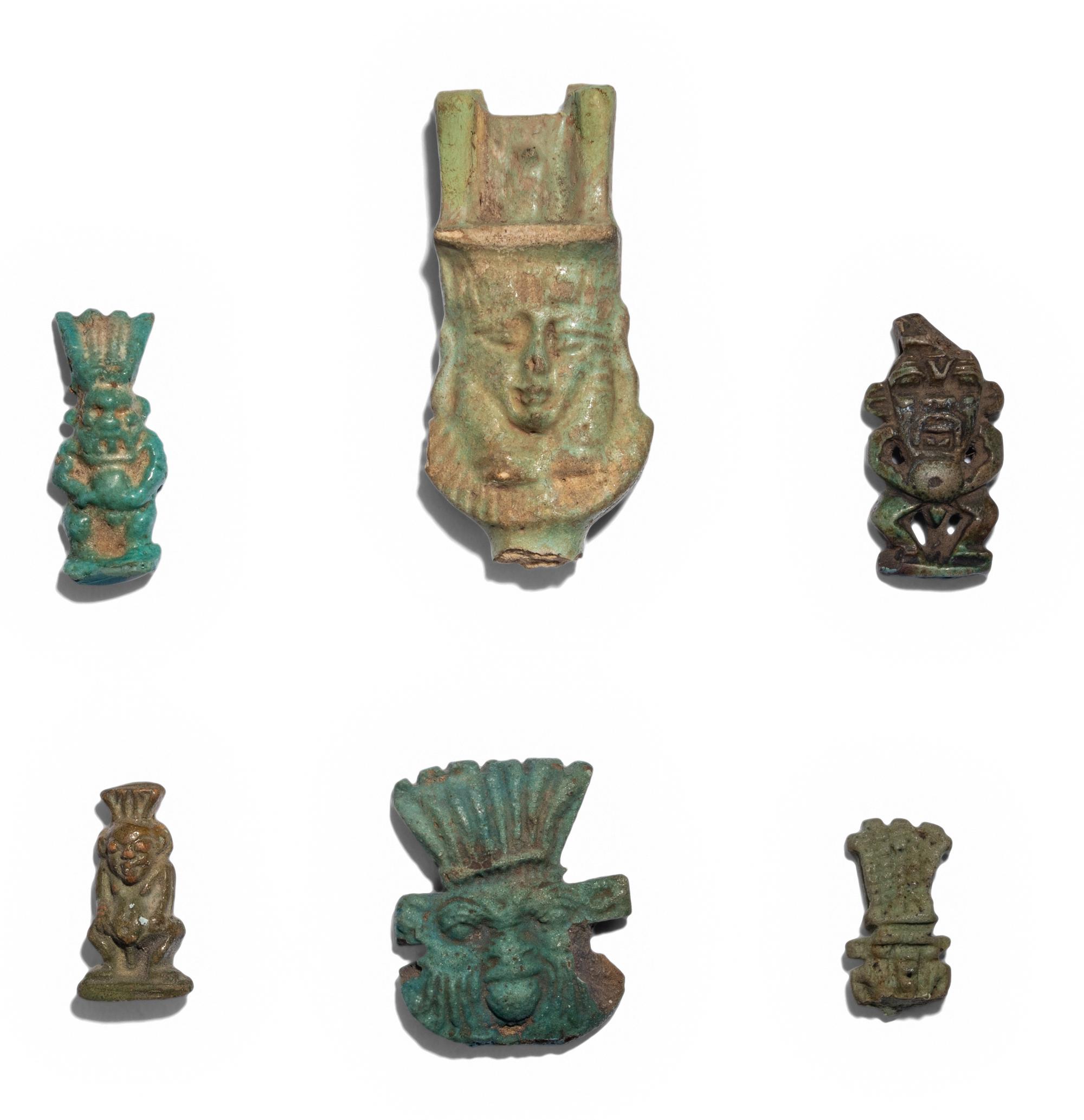 Eleven Egyptian Faience and Terracotta Bes Figures and Amulets